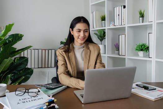 business woman entrepreneur in office using laptop at work, smiling professional female company executive wearing suit working on computer at workplace.