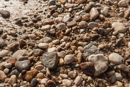 Pebbles on the seashore, close-up. Natural background