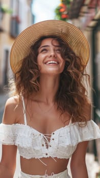 A woman in a white top and hat smiling at the camera