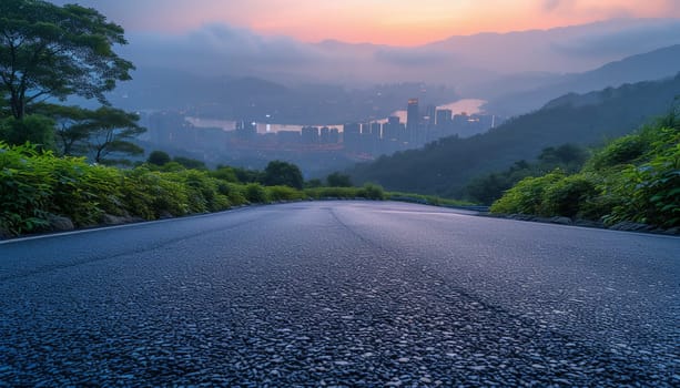 The perspective of the road against the background of sunset and the cityscape. High quality photo