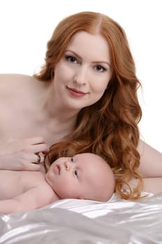 Portrait of beautiful red-haired woman and her little son