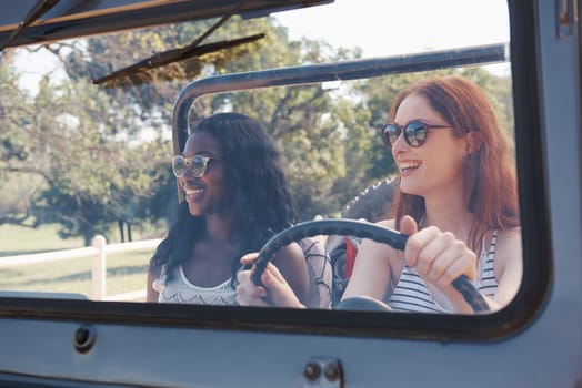 Happy women, diversity and travel on road trip in countryside and sightseeing for adventure in nature. Friends, driving and transportation in convertible suv on holiday and bonding together in texas.