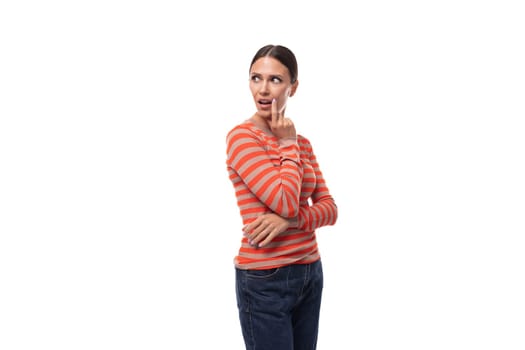 caucasian smart young black-haired woman with a ponytail hairstyle dressed in an orange jacket on a white background.