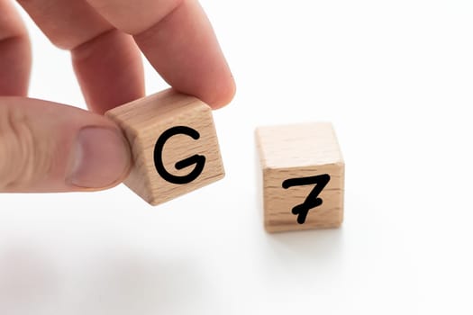 Human hand put wooden block and set technology word G7. Network future. High speed of mobile internet . High quality photo