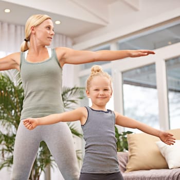 Yoga, exercise with mother and child in living room, stretching out arms for balance and bonding. Woman, young girl and fitness together at family home, health and wellness with love and care.