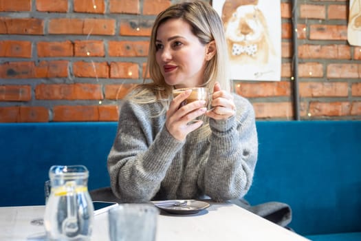 woman with a cup of coffee in a cafe. High quality photo