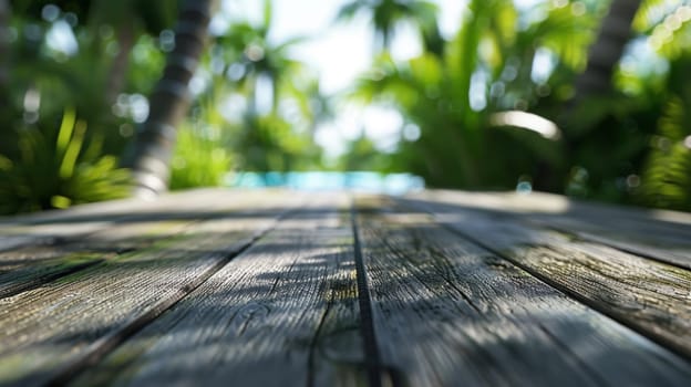 A close up of a wooden deck with palm trees in the background