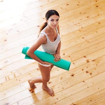 Woman, portrait and mat ready for yoga in home, health and meditation for spiritual awareness. Female person, pilates and exercise or fitness in living room, zen and mindfulness on mockup space.