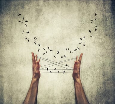 Man hands tied with thread playing cats cradle game with birds standing like on a wire and flying around. Trying to lure birds. Some birds are not meant to be caged