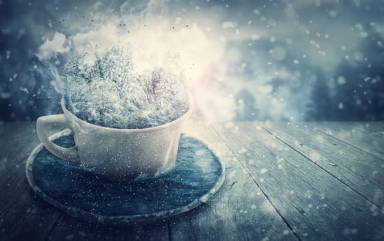Wonderful winter time scene, a surreal cup of tea with a fantasy microworld instead of beverage. Magical woodland with snowy coniferous trees surrounded by cold sea water. Christmas holiday background