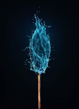 Different thinking concept as an unusual matchstick burning in a water flame. Blue liquid splash drops on a match, instead of fire. Surreal and unique symbol for eco energy and environmental issue