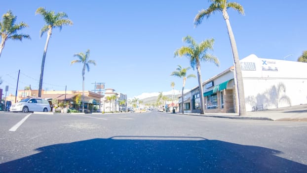 Santa Maria, California, USA-December 6, 2022-Car driving through the streets of Pismo Beach town, California during winter.