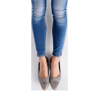 Woman legs in jeans and shoes isolated cut out image