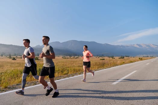 A group of friends maintains a healthy lifestyle by running outdoors on a sunny day, bonding over fitness and enjoying the energizing effects of exercise and nature.