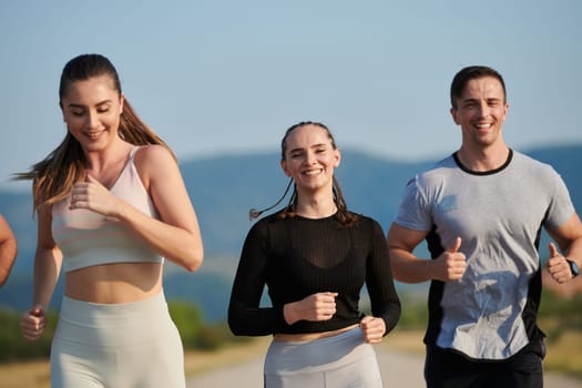 A group of friends maintains a healthy lifestyle by running outdoors on a sunny day, bonding over fitness and enjoying the energizing effects of exercise and nature.