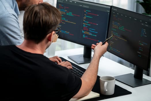 IT developers discussing online software development information on pc screen, creating program coding for latest version application on website. Concept of brainstorming firmware updated. Sellable.