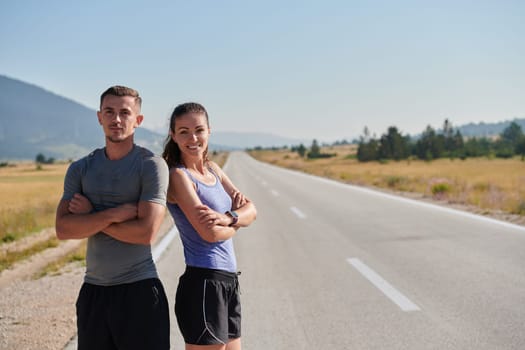 In a serene moment of post-run tranquility, a romantic couple rests together, embodying both exhaustion and affection after a rigorous training session.