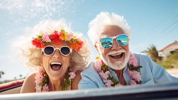 A smiling couple in a red convertible, enjoying a sunny day drive. The woman wears a red scarf, the man a blue shirt. No other cars on the road, surrounded by lush green trees.