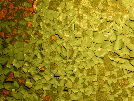 Peeling paint on the wall. Panorama of a concrete wall with old cracked flaking paint. Weathered rough painted surface with patterns of cracks and peeling. Wide panoramic grungy texture for background