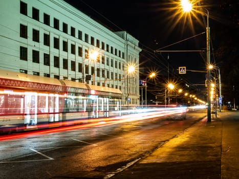 tram in a blurry form in the night city center , Moscow, Russia