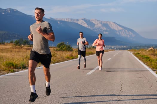 A group of friends maintains a healthy lifestyle by running outdoors on a sunny day, bonding over fitness and enjoying the energizing effects of exercise and nature.