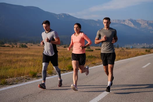 A group of friends maintains a healthy lifestyle by running outdoors on a sunny day, bonding over fitness and enjoying the energizing effects of exercise and nature.