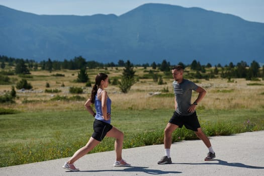 Exercise, mockup and couple workout and stretch together outdoors in nature by a mountain for health, wellness and fitness. People, partners and athletes training and keeping fit and heathy.