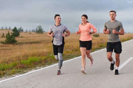 A group of friends, athletes, and joggers embrace the early morning hours as they run through the misty dawn, energized by the rising sun and surrounded by the tranquil beauty of nature.