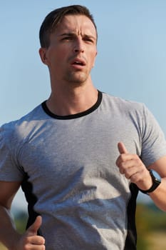 A highly motivated marathon runner displays unwavering determination as he trains relentlessly for his upcoming race, fueled by his burning desire to achieve his goals.