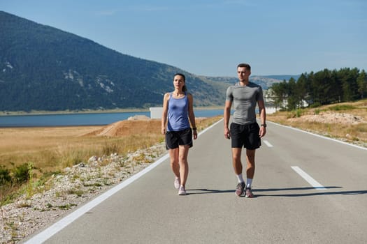 In a serene moment of post-run tranquility, a romantic couple rests together, embodying both exhaustion and affection after a rigorous training session.