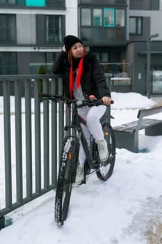 A woman rented a bicycle to ride around the city in winter..