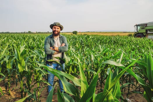 Portrait of farmer who is cultivating corn. Agricultural occupation.