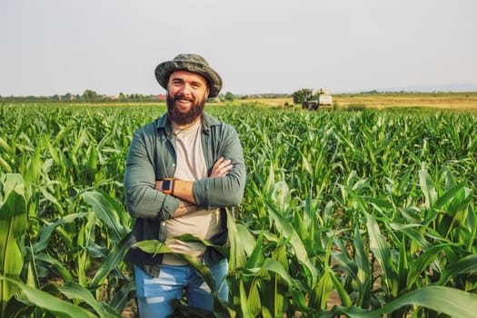 Portrait of farmer who is cultivating corn. Agricultural occupation.