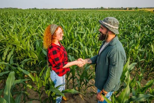 Portrait of farmers who are cultivating corn. Agricultural occupation.