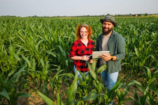 Portrait of farmers who are cultivating corn. Agricultural occupation.