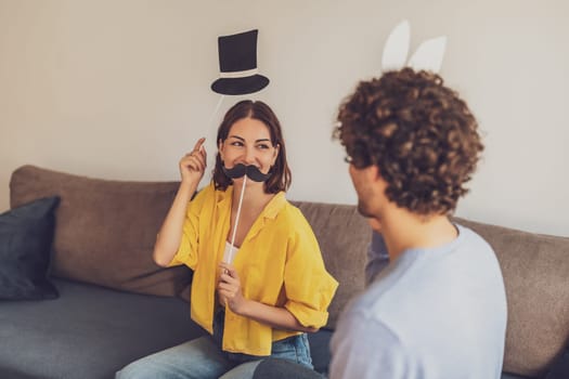 Portrait of young happy couple at home. They are having fun.