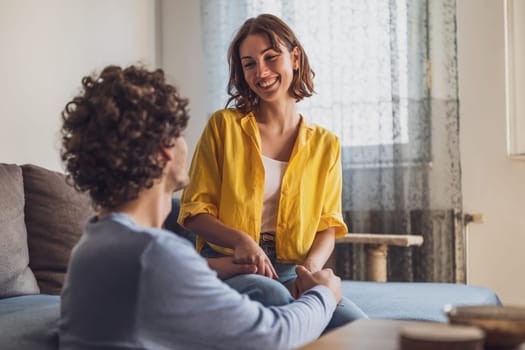 Portrait of young happy couple at home.