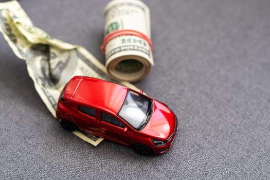 car and money. concept of car loan Rent insurance buy car Toy car and money over white.