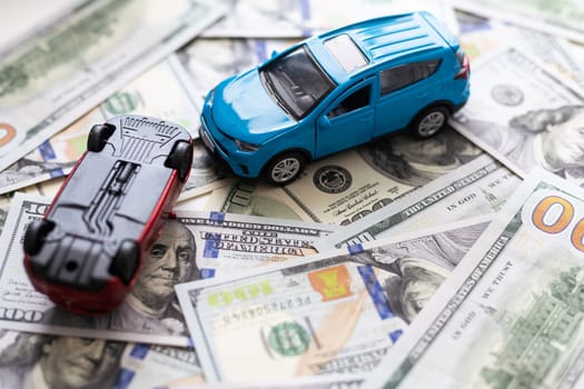 car insurance, imitation collision, amid American banknotes. High quality photo