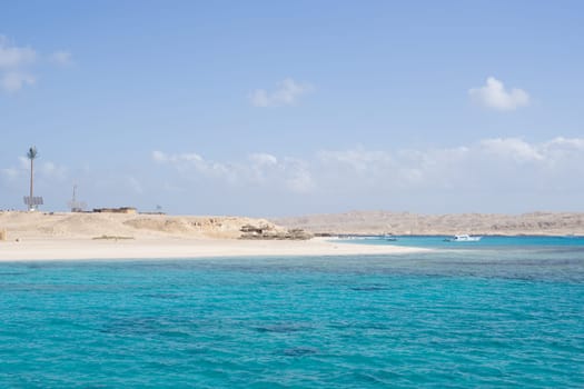 Beach Relaxation at the Red Sea. Fairy-tale Moments of a Sunny Day. The concept of tourism and sea travel.