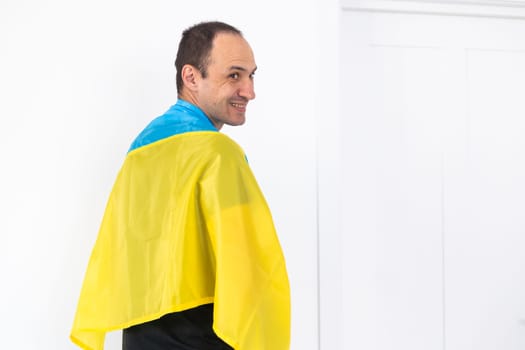 Portrait of a middle aged man with flag of Ukraine. High quality photo