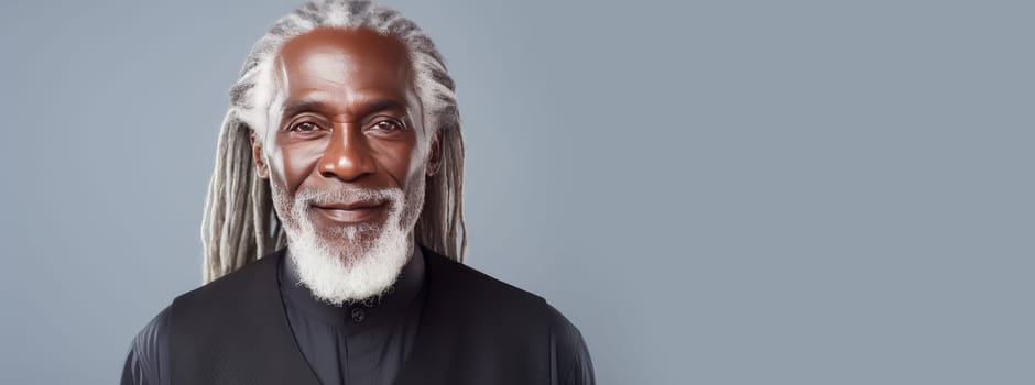 Handsome elderly black African American man with long dreadlocked hair, on a gray background, banner. Advertising of cosmetic products, spa treatments, shampoos and hair care products, dentistry and medicine, perfumes and cosmetology for senior men.