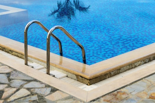 handrails ladder in a swimming pool in a residential complex