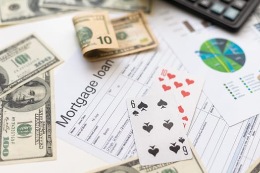 credit card statement with bank account, calculator on desk, gambling card.