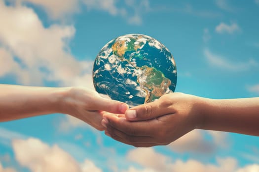 Two human hands holding Earth on a sky background. Environmental care and global unity concept.