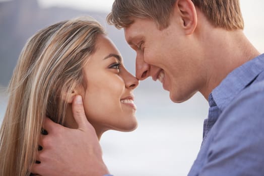 Couple, nose and touch with smile in outdoor for love with romance in honeymoon, vacation and affection in Australia. Closeup, holiday and happy with bonding for relationship, support and trust.