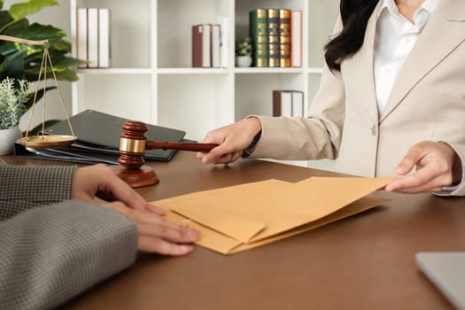 A young lawyer and businesswoman are discussing legal advice on signing a business contract. Insurance or financial contract signing.