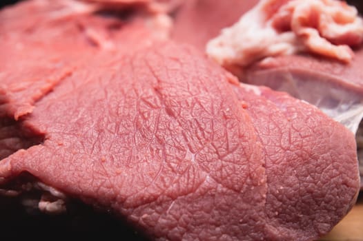 Raw large premium steak. Raw fresh premium beef in shallow depth of field.