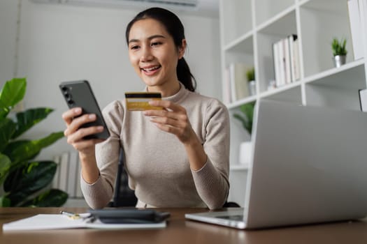 Woman make purchase on Internet, making online payment credit card on laptop.