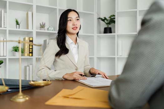 Lawyers provide advice to client are business partner. Lawyer working with client discussing contract document in office, consulting to help customer.